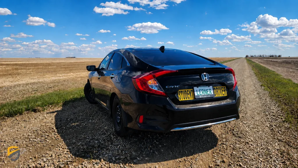 SGI Certified driving school vehicle on Saskatchewan gravel road for student driver training in Regina